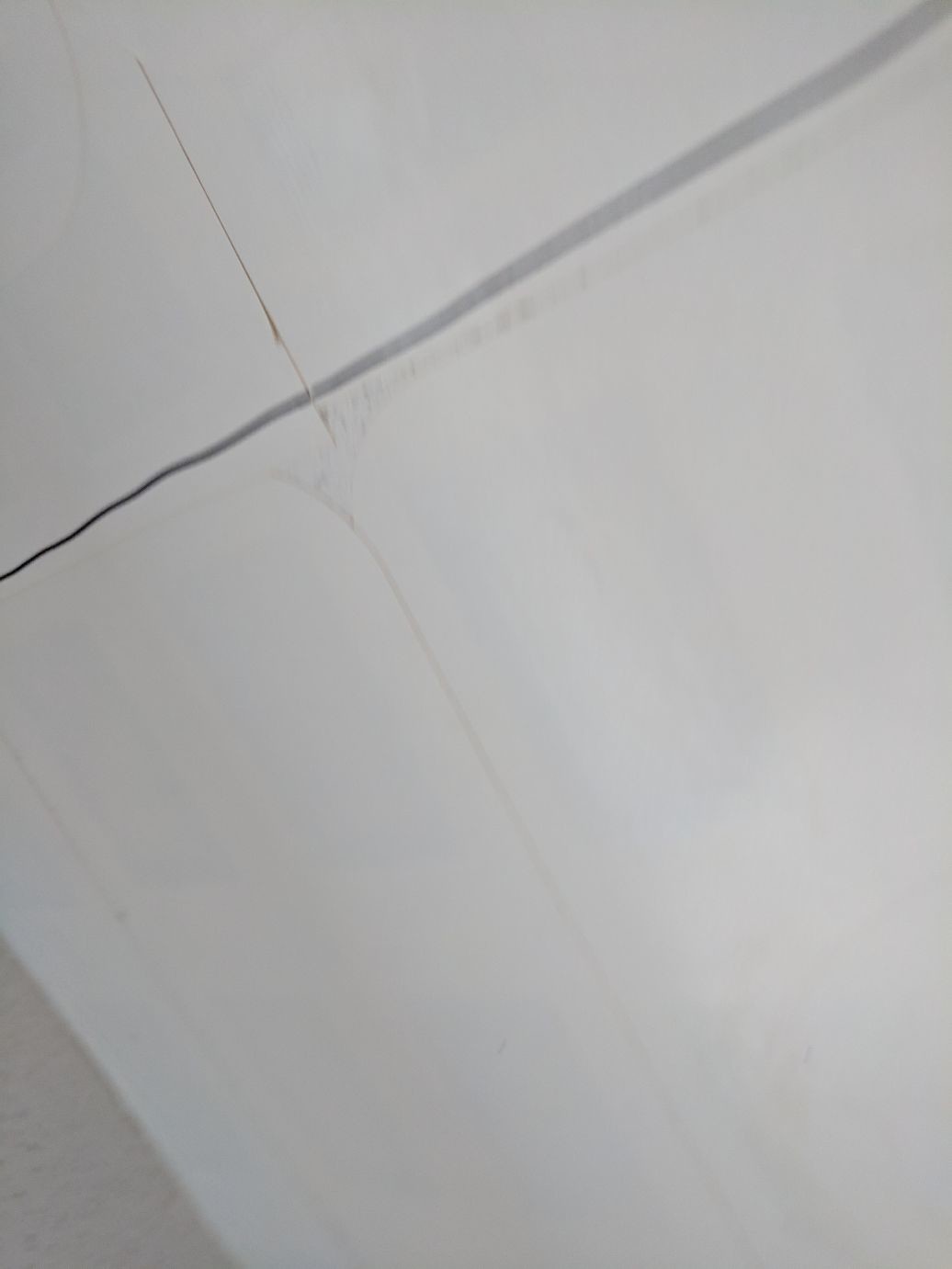 the underside of a table with NFC tags taped to it