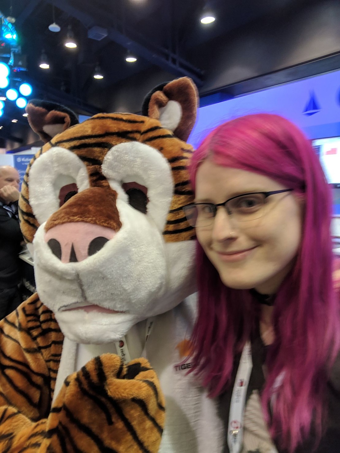 me posing with a person in a tiger costume