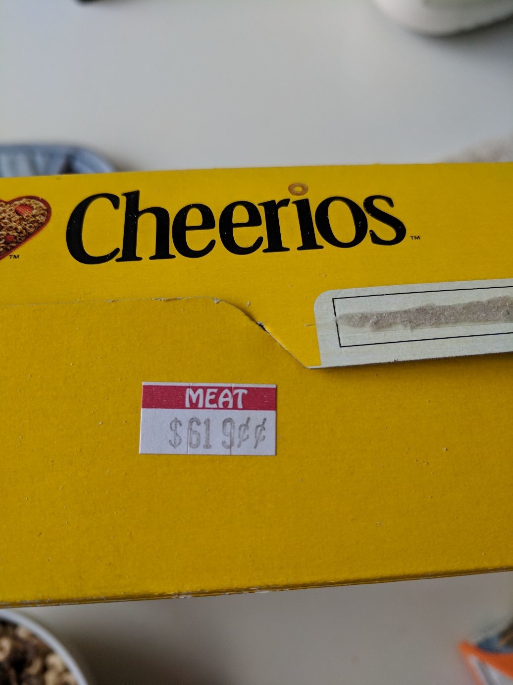 Cheerios, with a price sticker labelled “meat”
