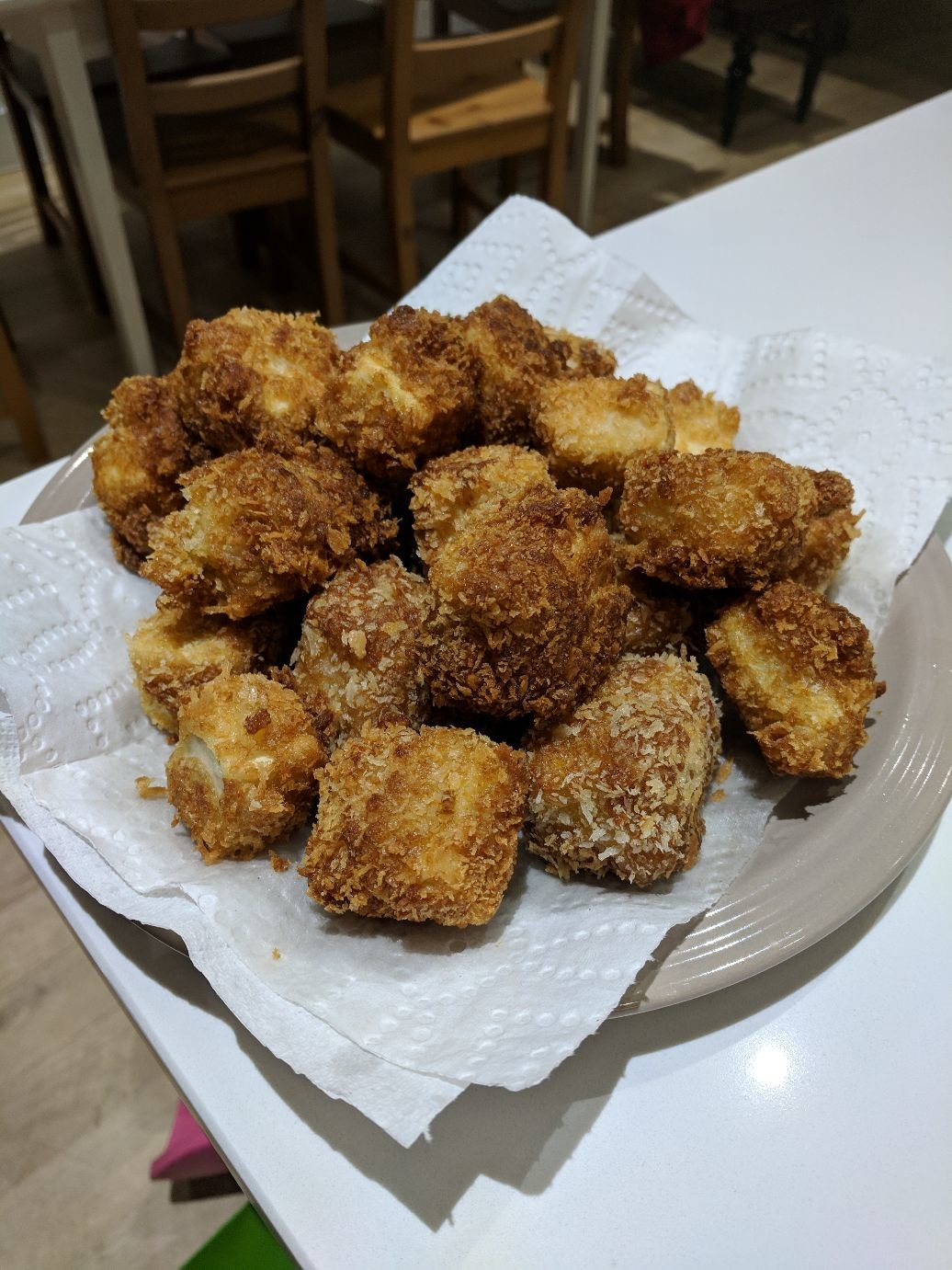  cubes of tofu covered in golden bread crumbs