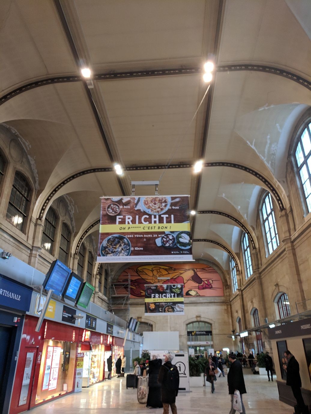 a beautiful arched ceiling marred by ads