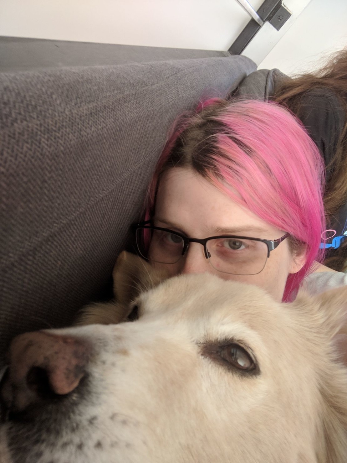 me cuddling up to close to Flurry on a couch