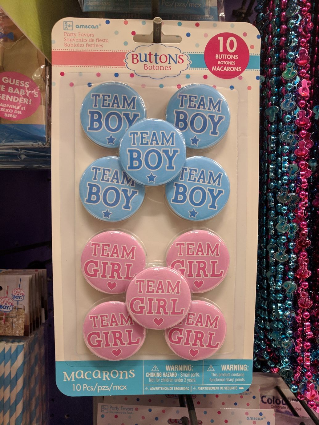 gender reveal buttons that say TEAM BOY and TEAM GIRL