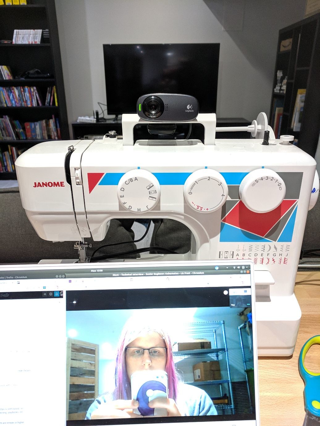 a webcam mounted on the handle of a sewing machine