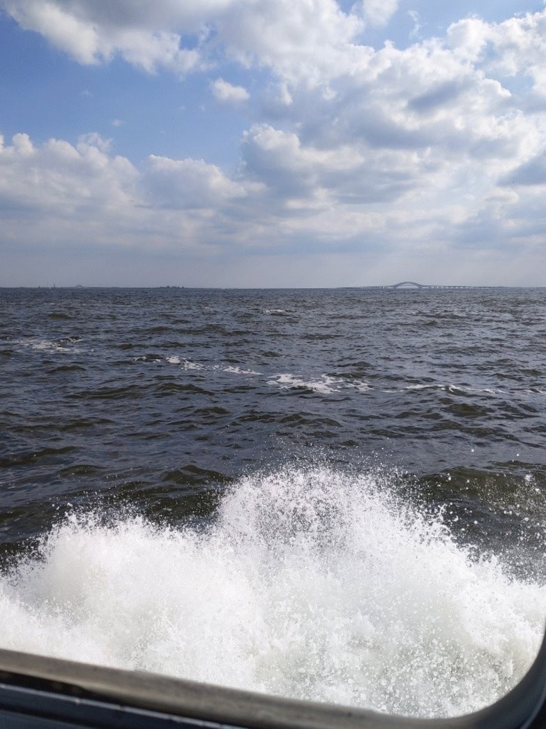 Waves crashing against the side of a boat