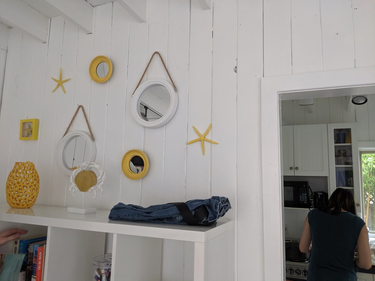 A cottage wall covered in miscellaneous ocean stuff