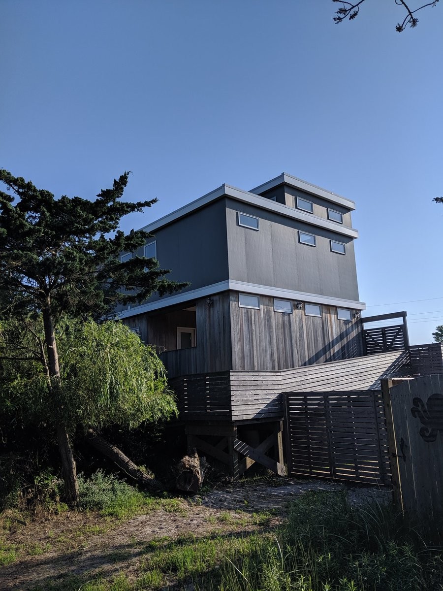 A very boxy house clad in steel and wood