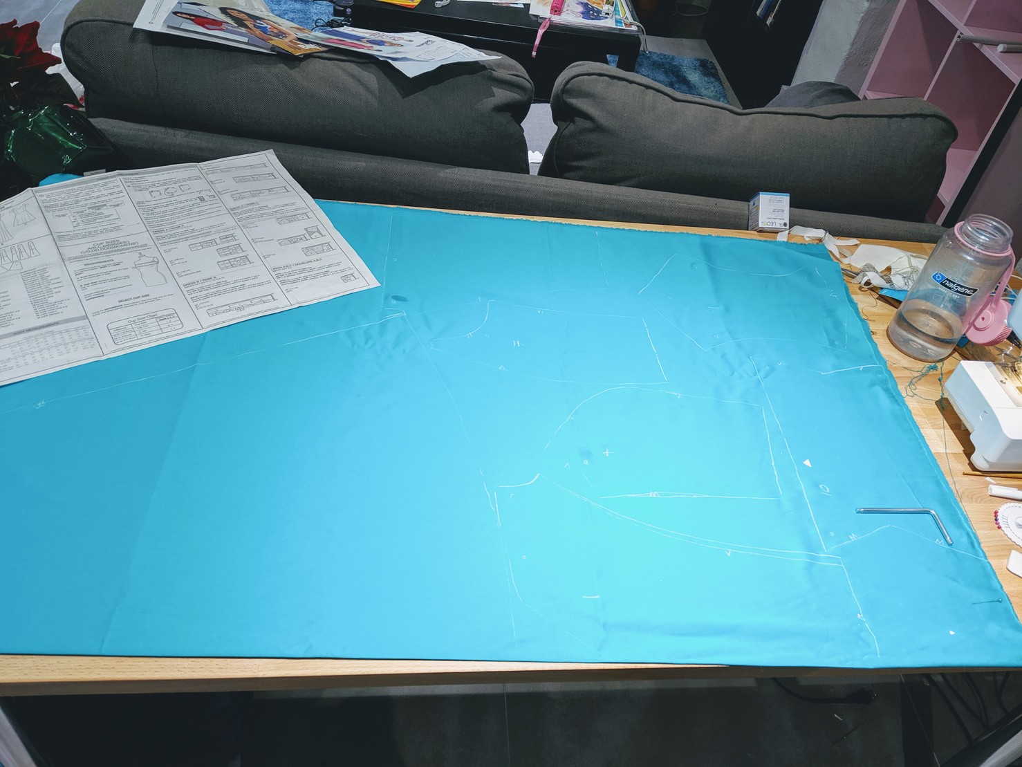 a large piece of blue fabric covered in tailor's chalk