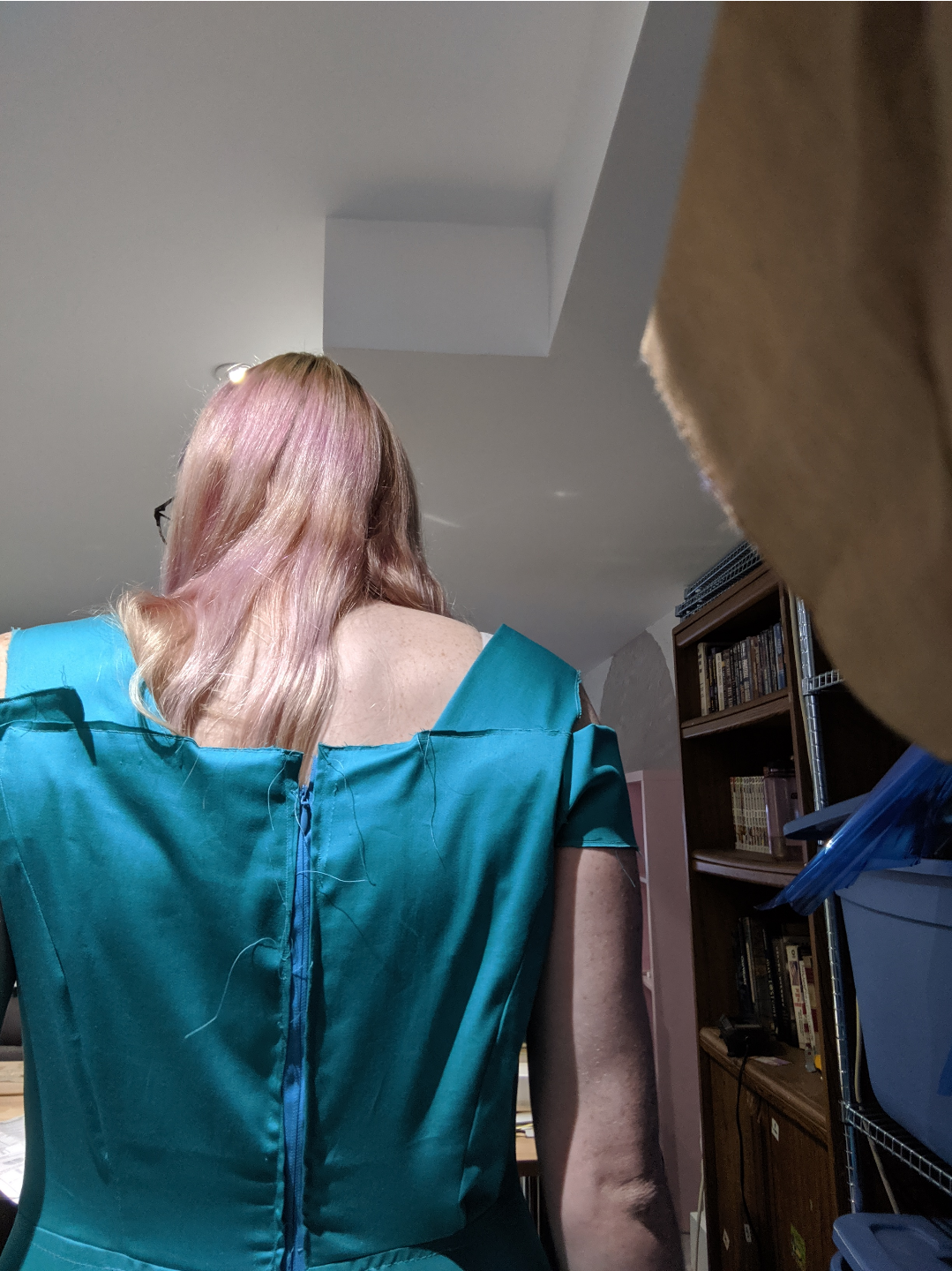 a zipper messily sewed up the back of a dress