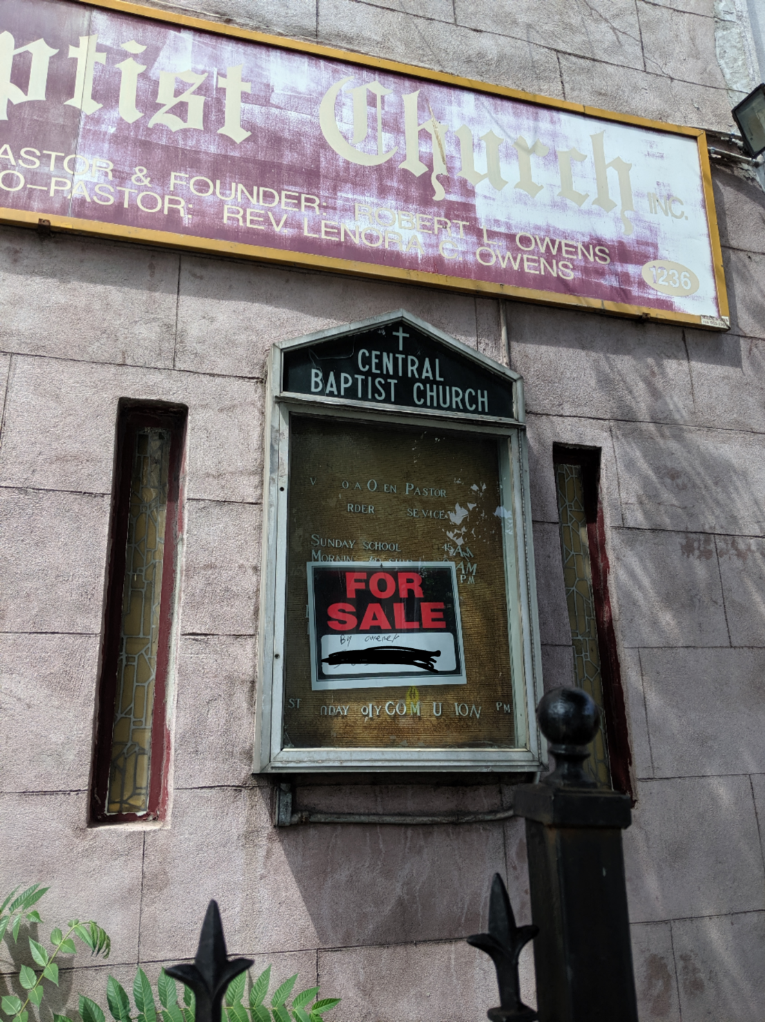 a church with a for sale sign