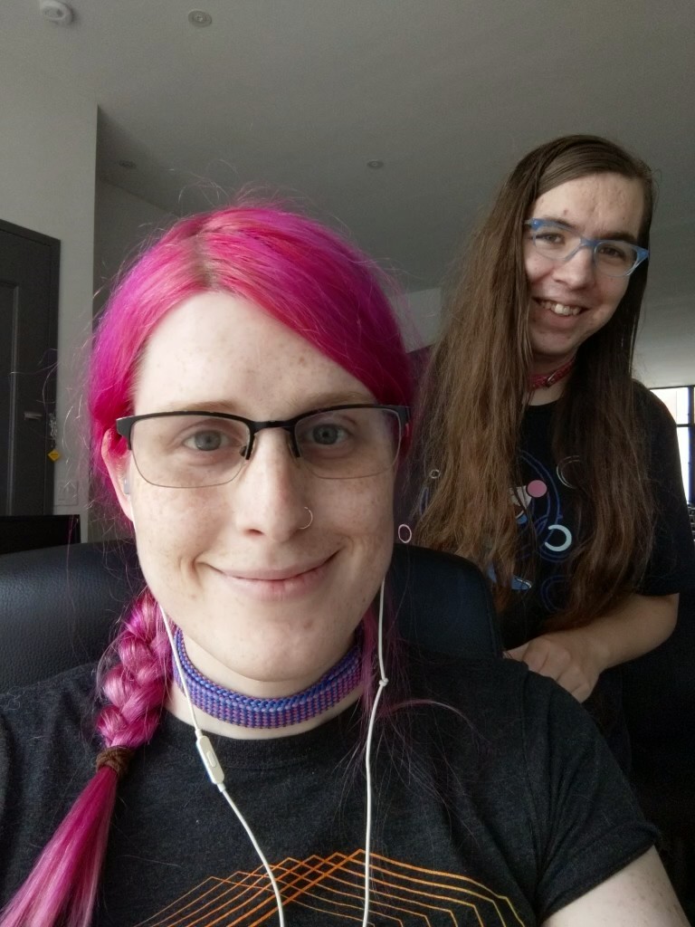 a selfie of me, a pink haired girl with braided hair, and a smiling Natalie behind me
