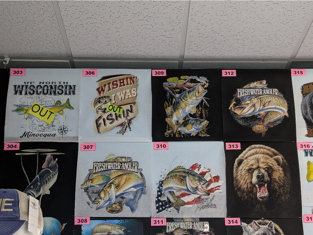 a bunch of fishing slogan t-shirts
