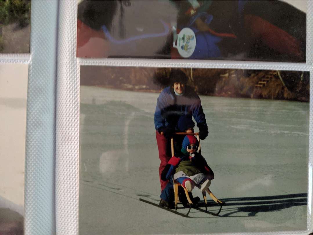 me all bundled up in sunglasses on a ice skating sled