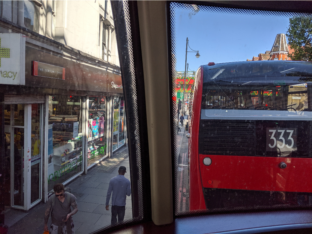 the view from the top of a red double-decker bus