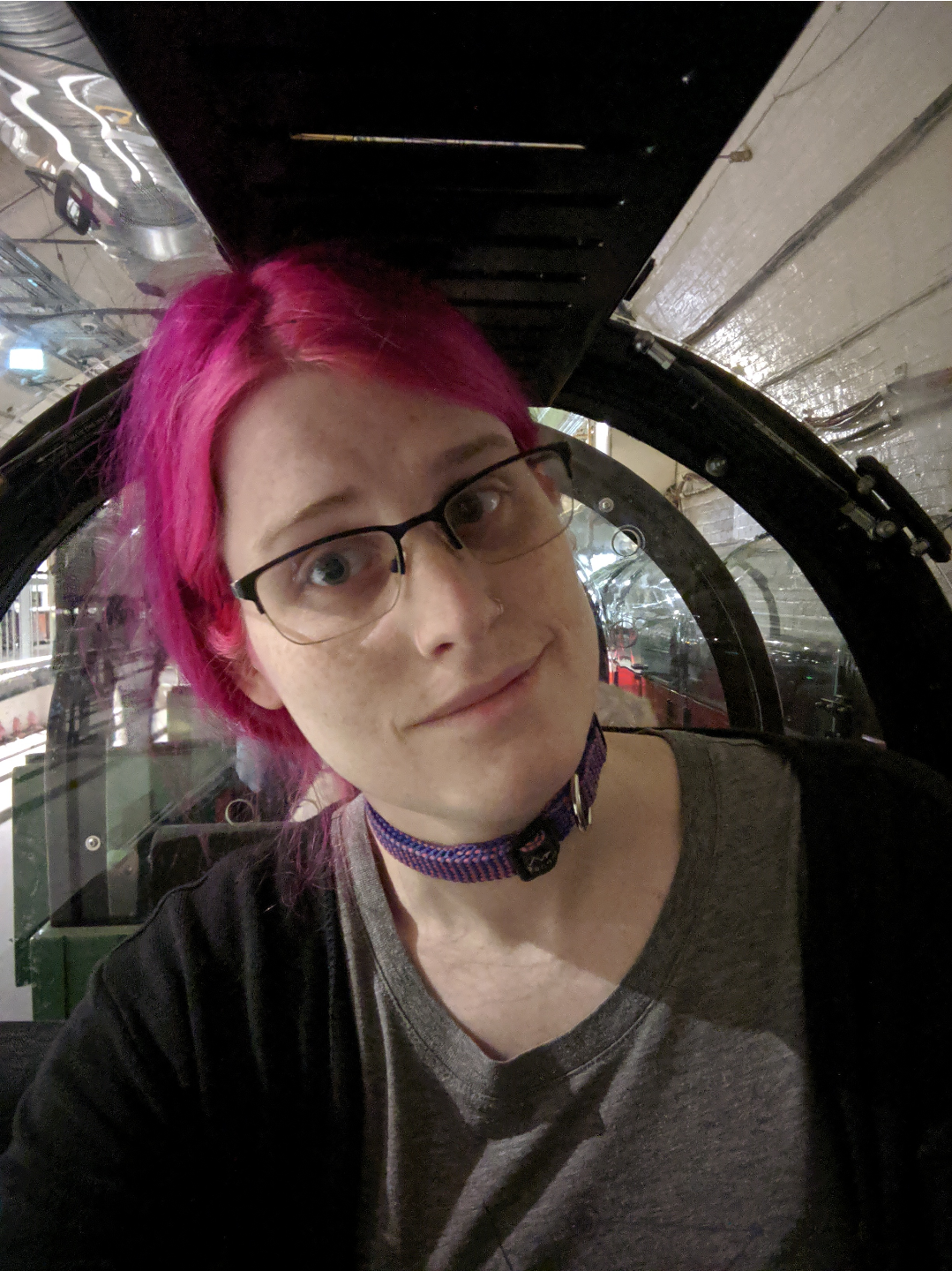 a selfie of me, cramped in a low mail rail carriage