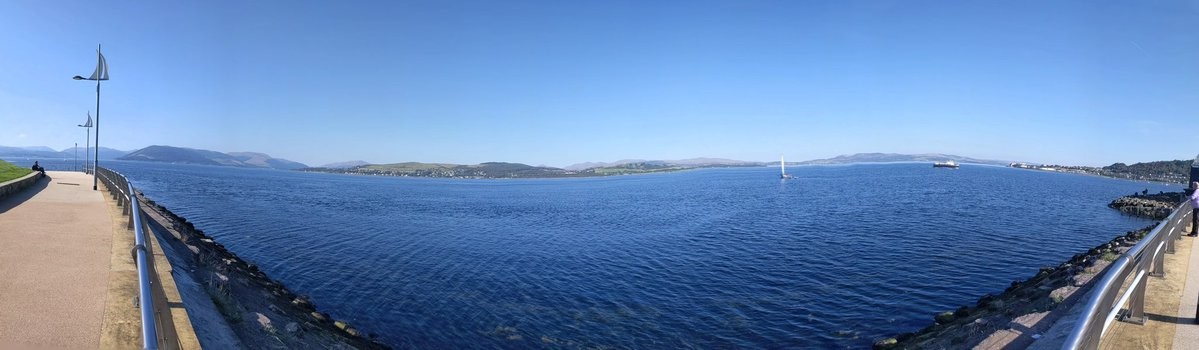 A panorama looking across a bay to a Scottish Fjord