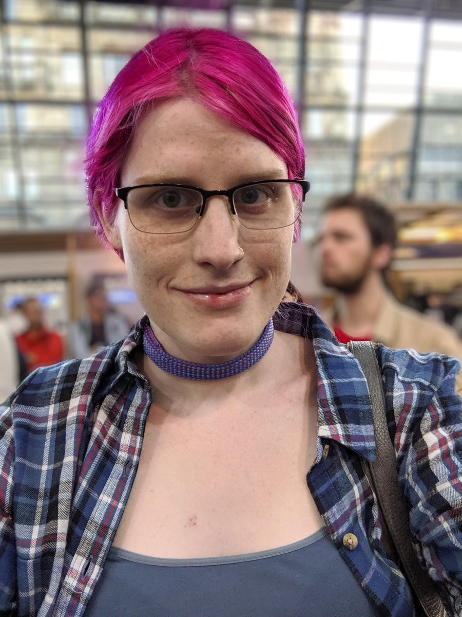 A similar selfie, but my flannel is open now and I'm in a train station