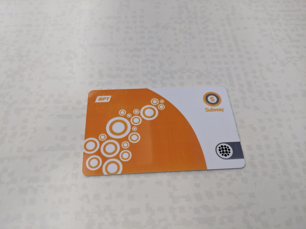 A smart card, with a bunch of white bubbles across an orange background