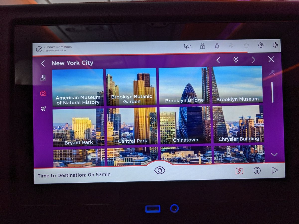 A user interface of tiles labelled New York City. The background is a London skyscape