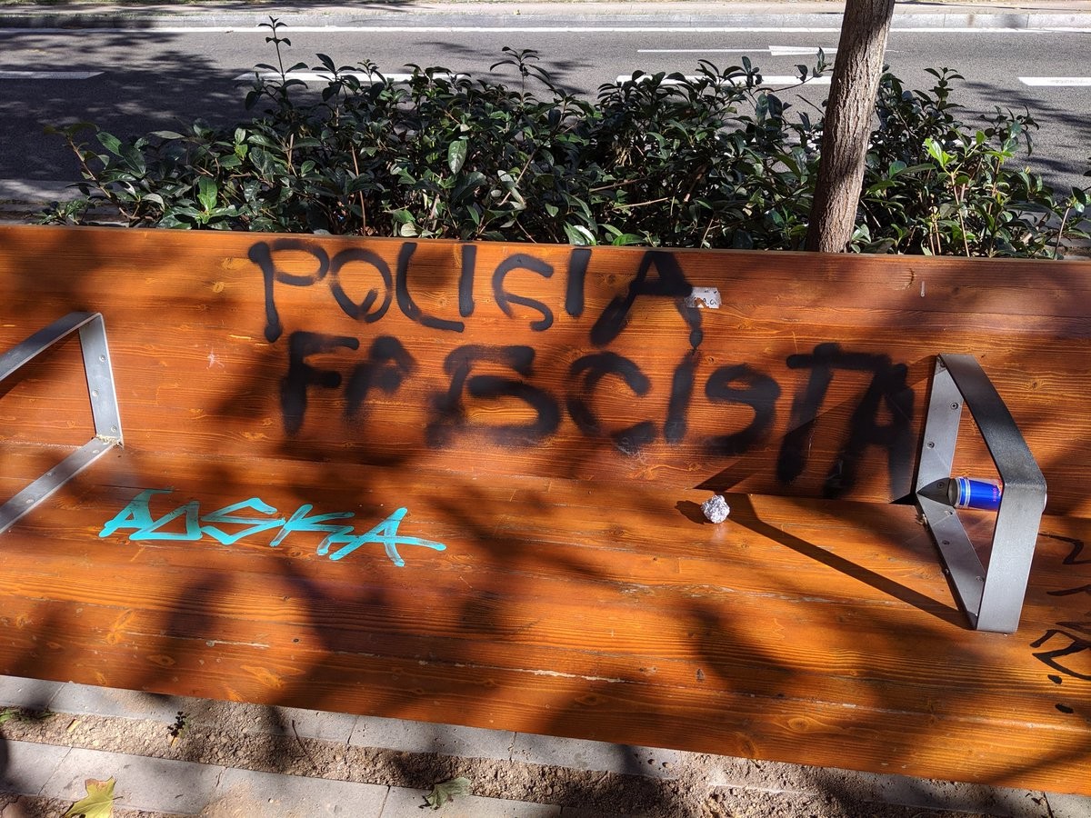 Polisia Fascista graffitid on a bench