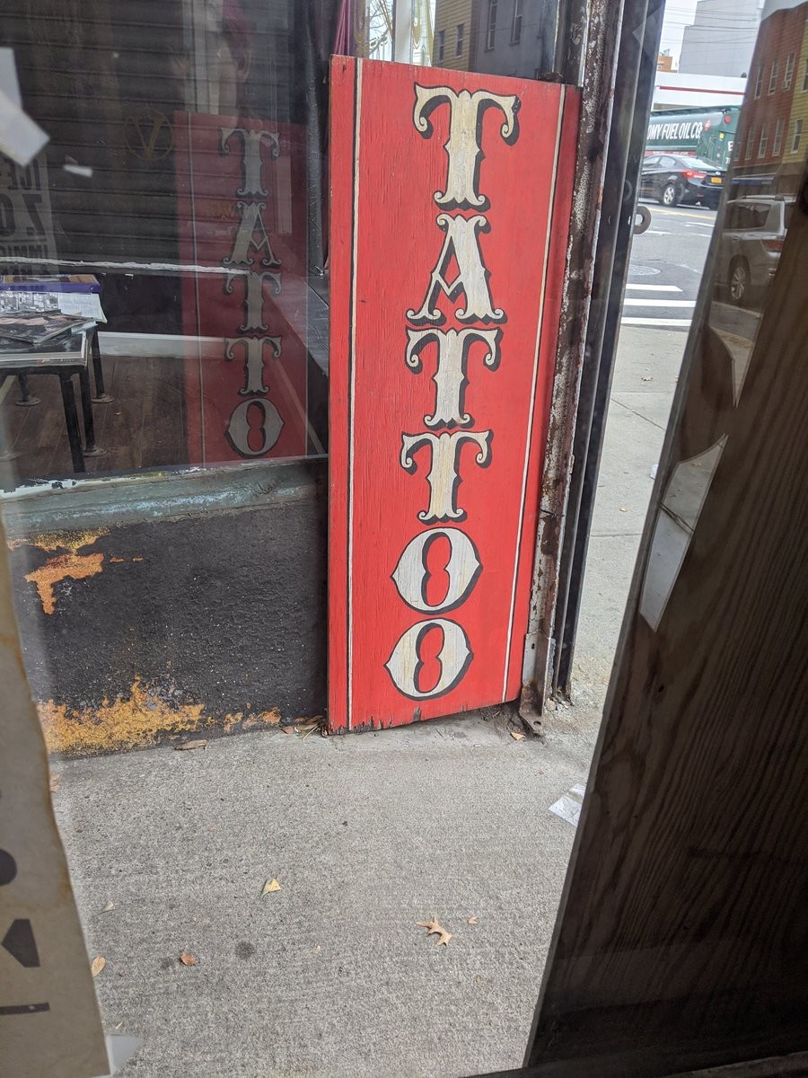 A sign reading TATTOO