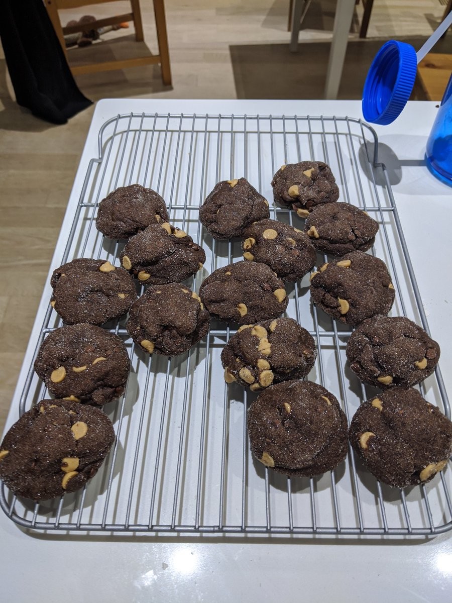 A cooling rack full of cookies