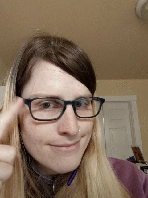 A gif of me tapping the side of my glasses in a "think about it" kinda gesture