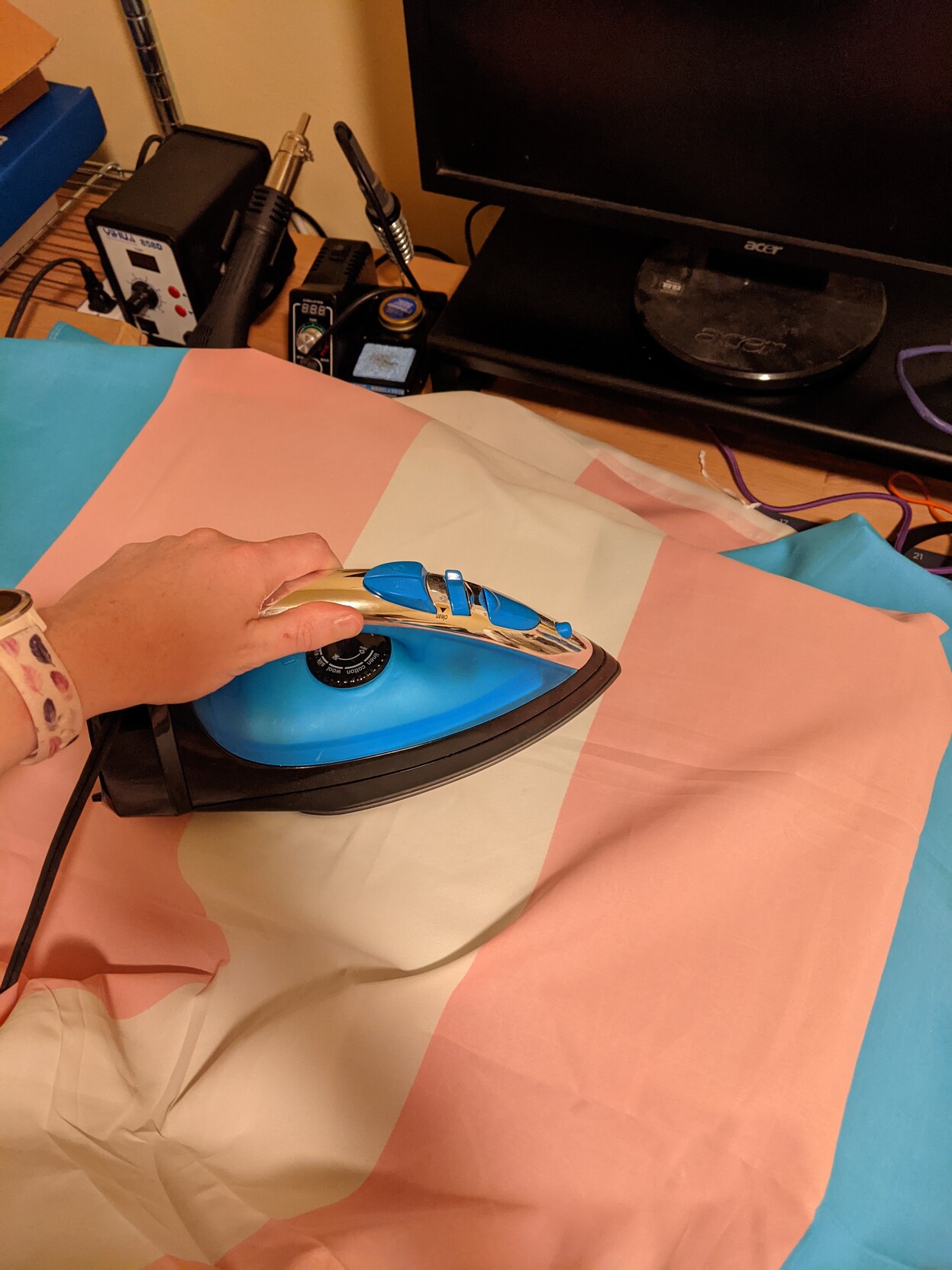 Ironing a trans pride flag